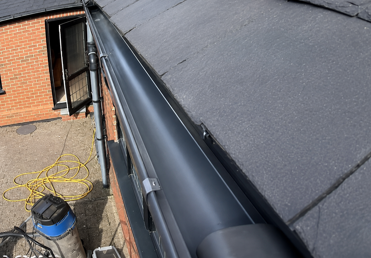 After gutter cleaning — the same West Midlands gutter restored to full function